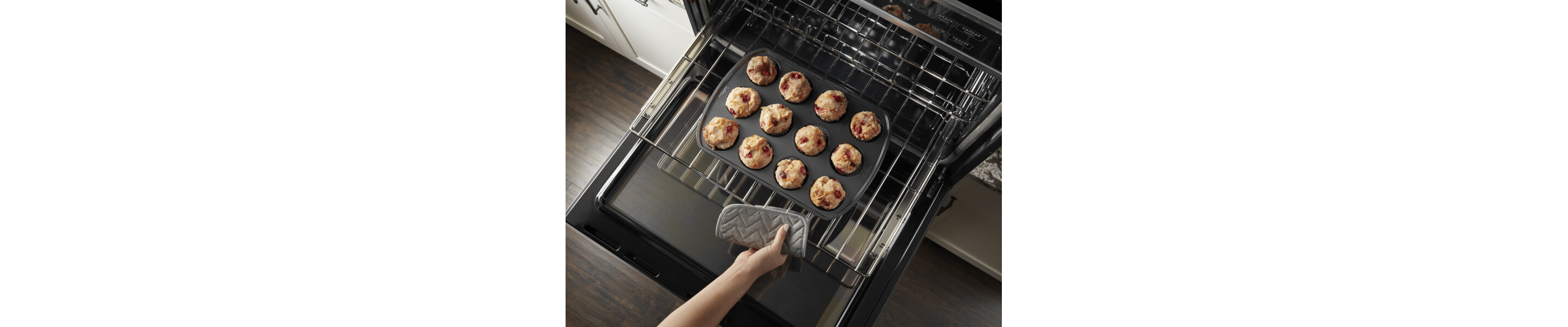 An overhead view of a Maytag® stove rack with a muffin pan