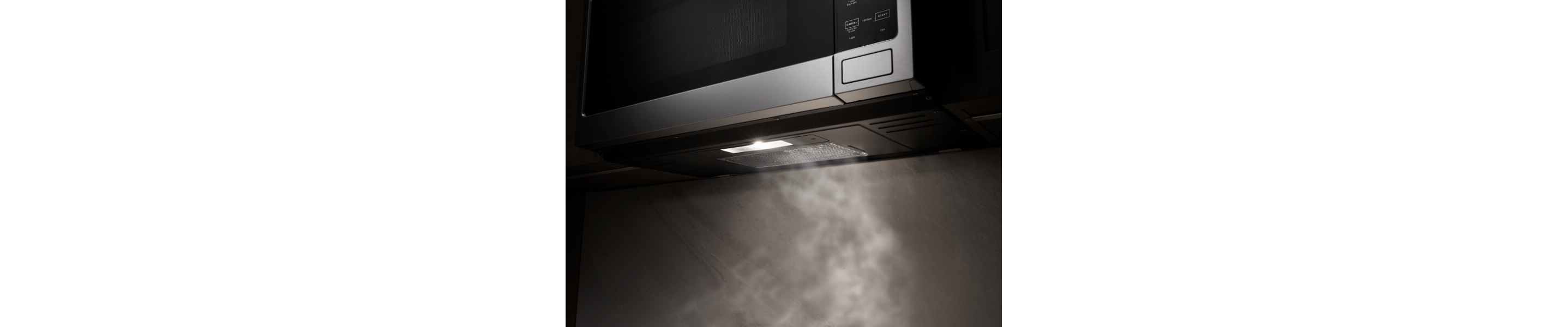 A close up of a Maytag® over-the-range microwave with ventilation