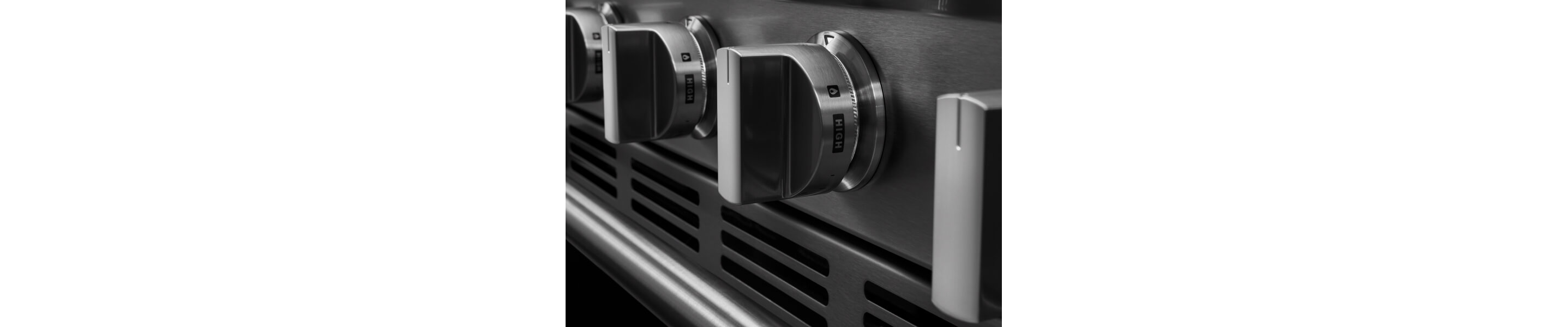 A close up of Maytag® stove cooktop knobs