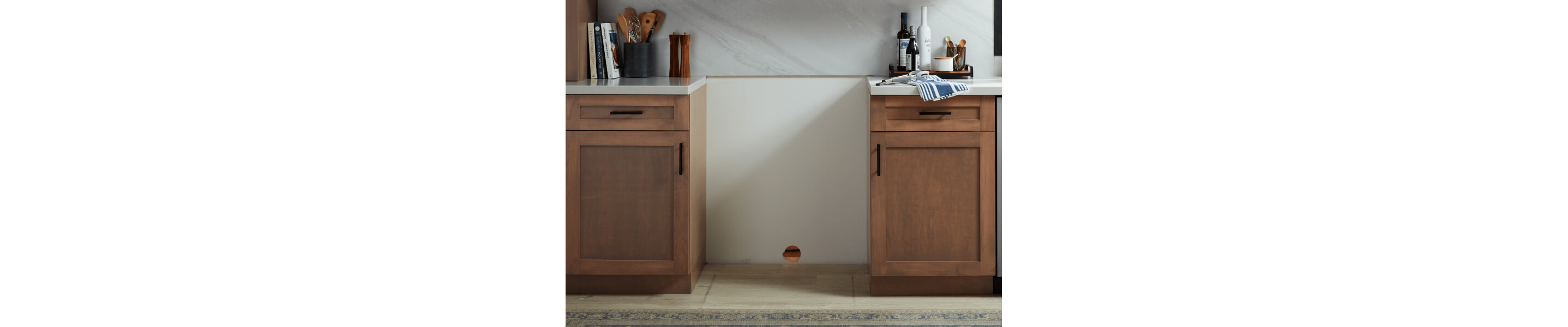 An open space to place a stove between cabinets