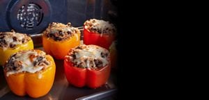Stuffed peppers baking inside an oven