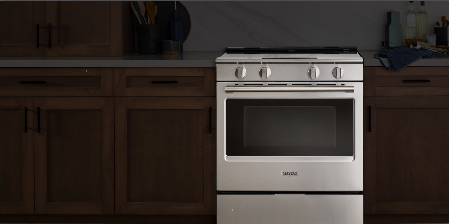 A slide-in range prominently displayed in a kitchen.