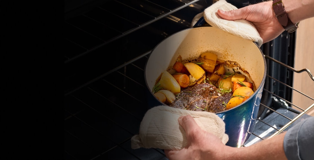 A beef stew slow cooking in the oven