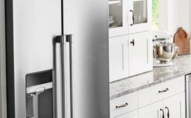 Counter-depth refrigerator flush with kitchen cabinets.