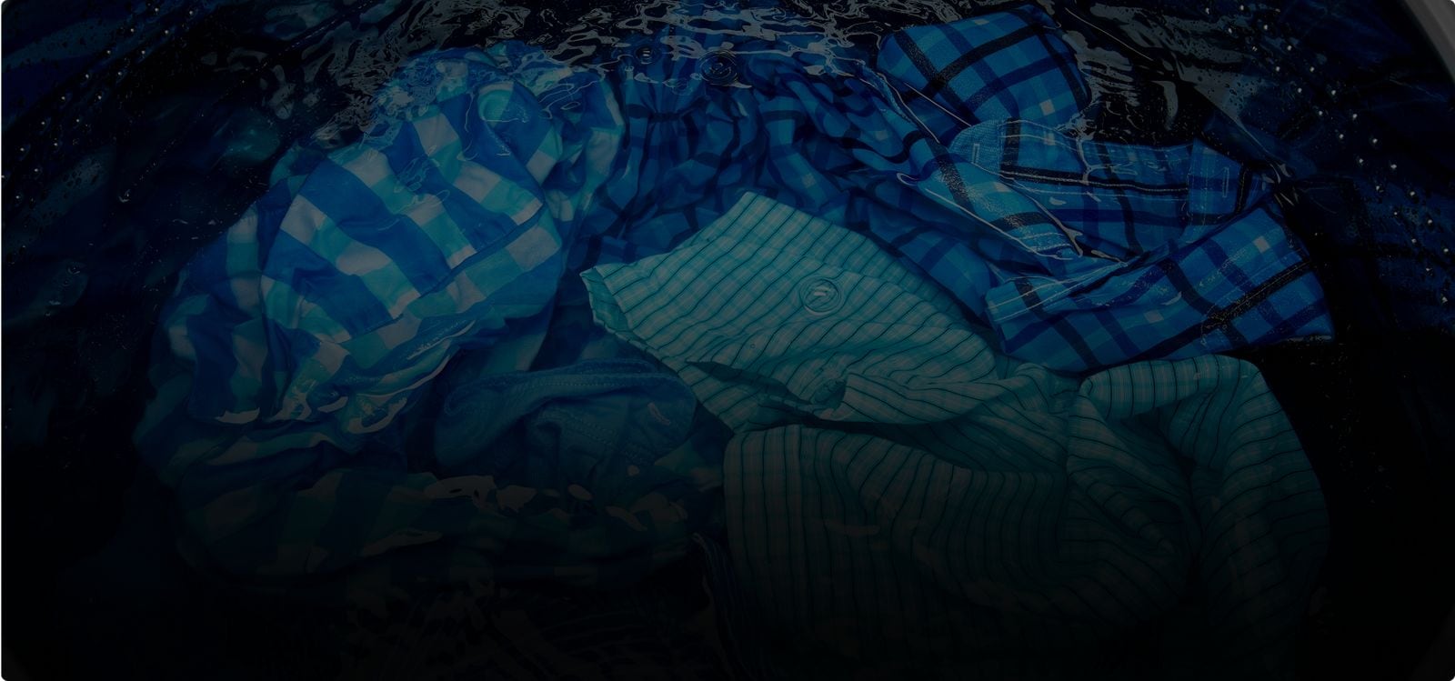 Top load washer with lid open.