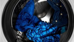 Clothes tumbling in washer at night.