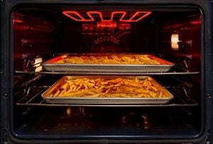 A close up of a food cooking in an oven.