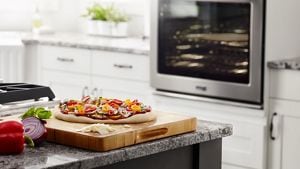 A flatbread pizza on a cutting board with a wall oven in the background.