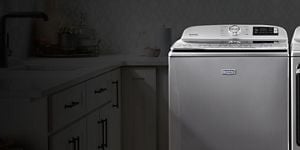 A Maytag® washing machine in metallic slate.