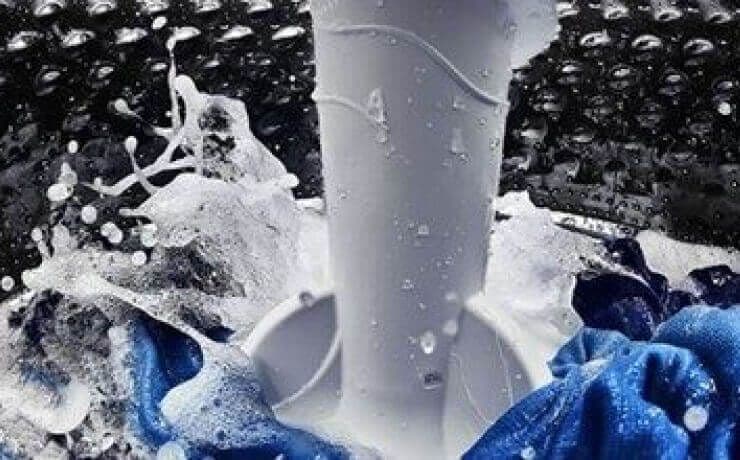 Interior view of a Maytag® washing machine with an agitator.