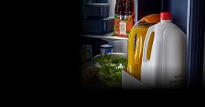 An open Maytag® refrigerator with food inside