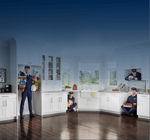 The Maytag Man inside a refrigerator, dishwasher, range and microwave cutout in a kitchen