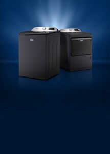 Angled Maytag® washer and dryer with light coming from behind