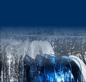 Dishes being washed inside of a Maytag® dishwasher