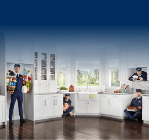The Maytag Man inside a refrigerator, dishwasher, range and microwave cutout in a kitchen