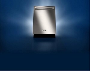 A stainless steel dishwasher against a dark background.