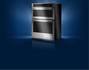 A Maytag® double wall oven with light streaming in from behind