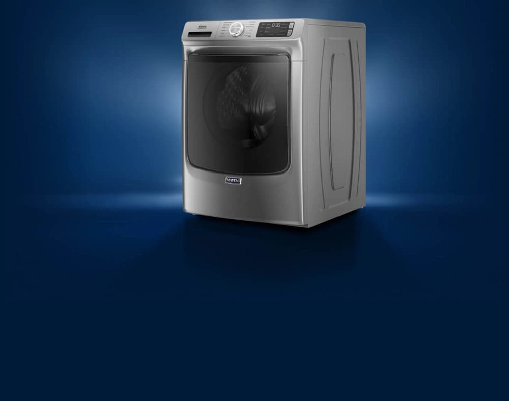 A Maytag® washing machine with light streaming in from behind