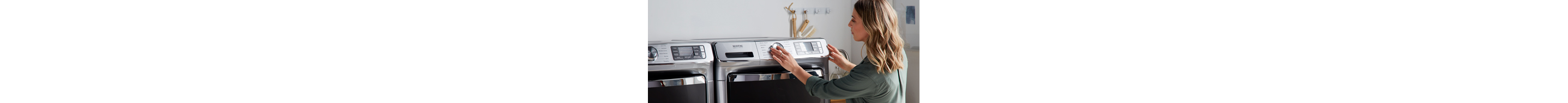 Woman setting Maytag dryer