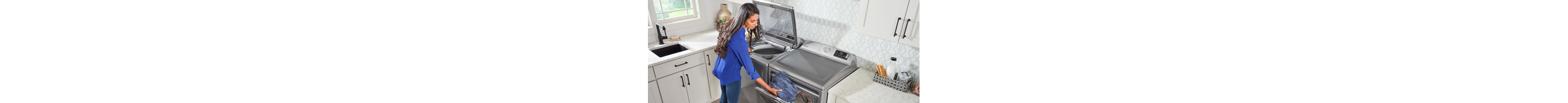 Woman loading Maytag dryer